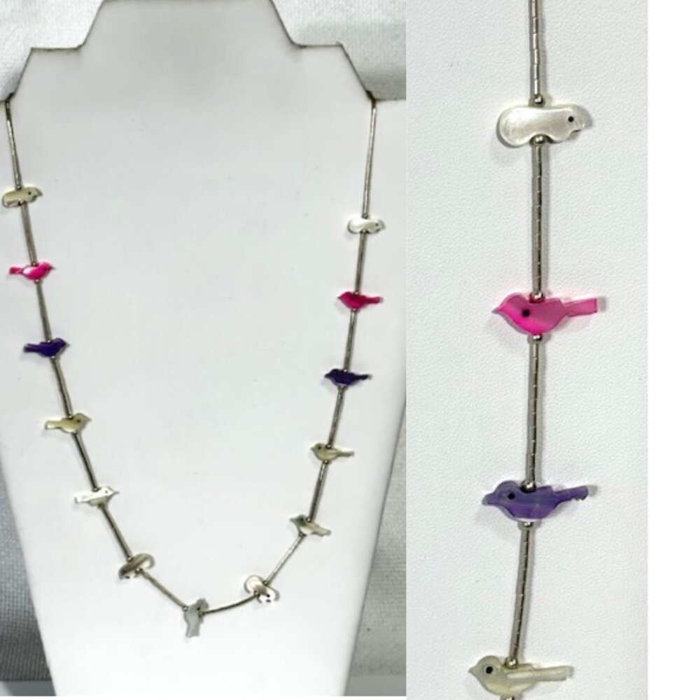 Sterling silver and multi-colored fetish necklace.